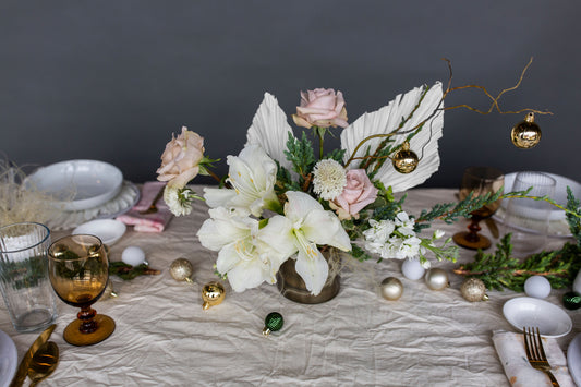 A table scape of beautiful holiday flowers and decor