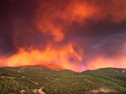 Image of Colorado Thunder Storm at Sunset. Bright pink and orange clouds.